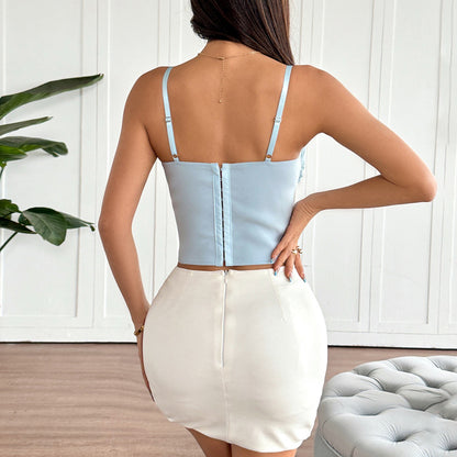 Back view of pastel blue corset top with crisscross straps and lace trim