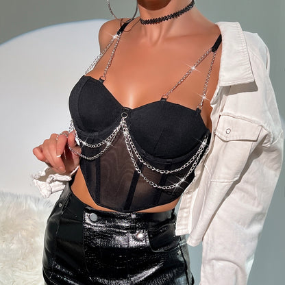 Texture detail of sheer black mesh fabric on structured bustier top
