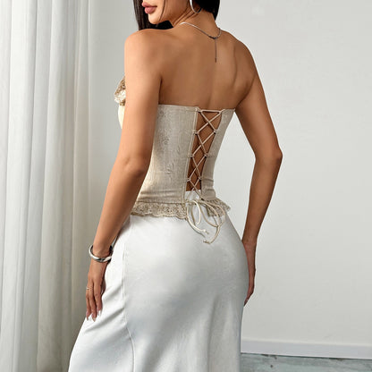 Back view of beige satin corset top with zipper closure and sculpted boning