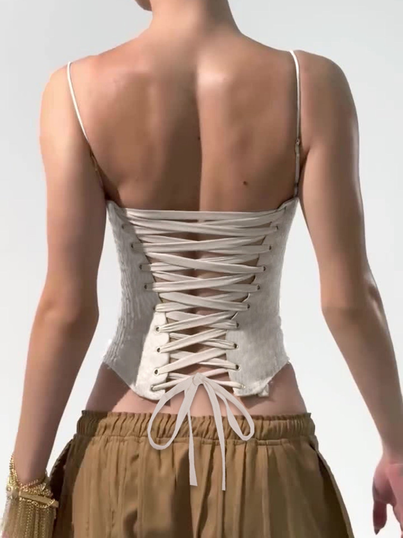 Back view of lace-up sequin corset in khaki – Bare Horizon