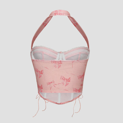 Back view of pink corset with adjustable ribbon lacing and halter strap