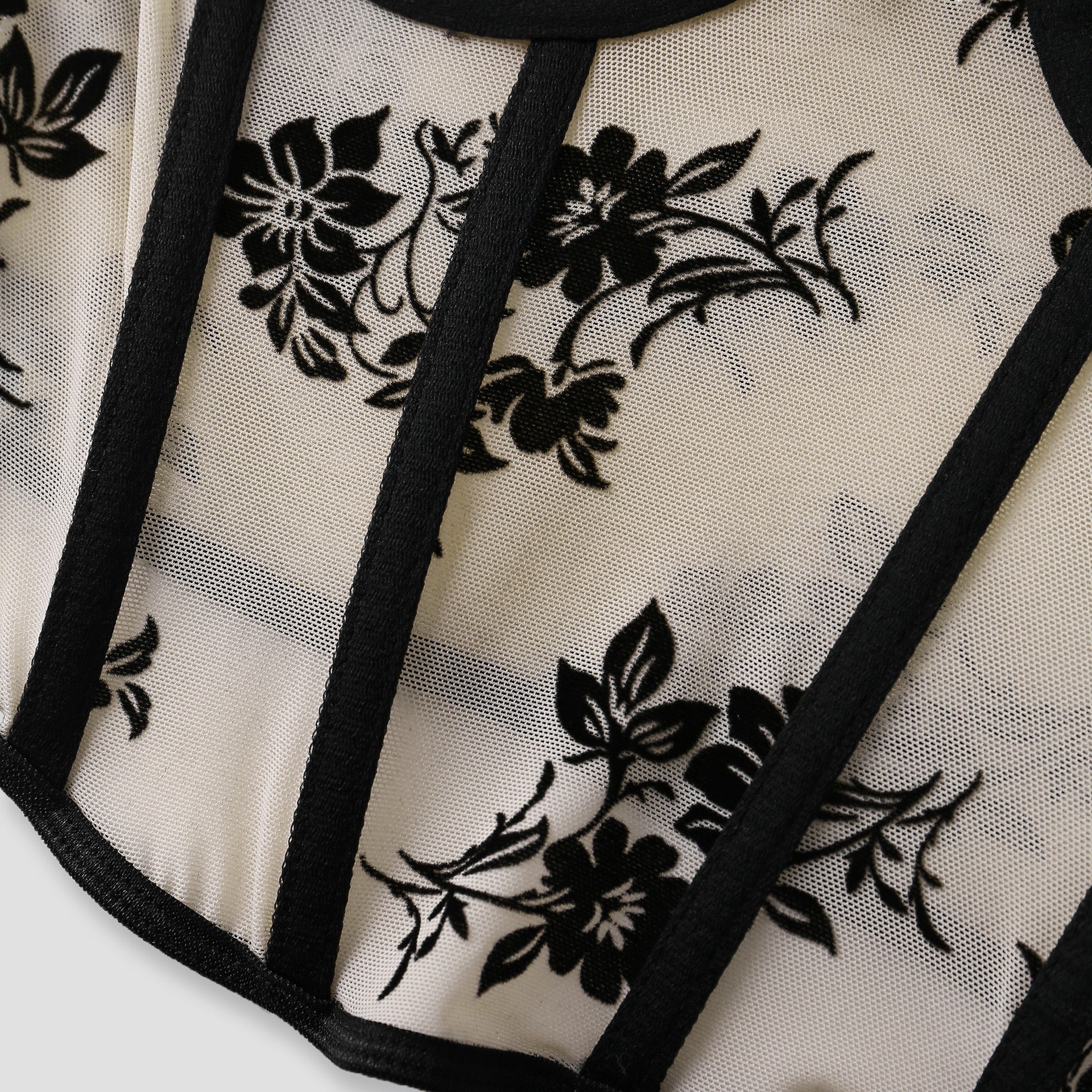 Side view showing contrast boning on beige mesh bustier – Bare Horizon