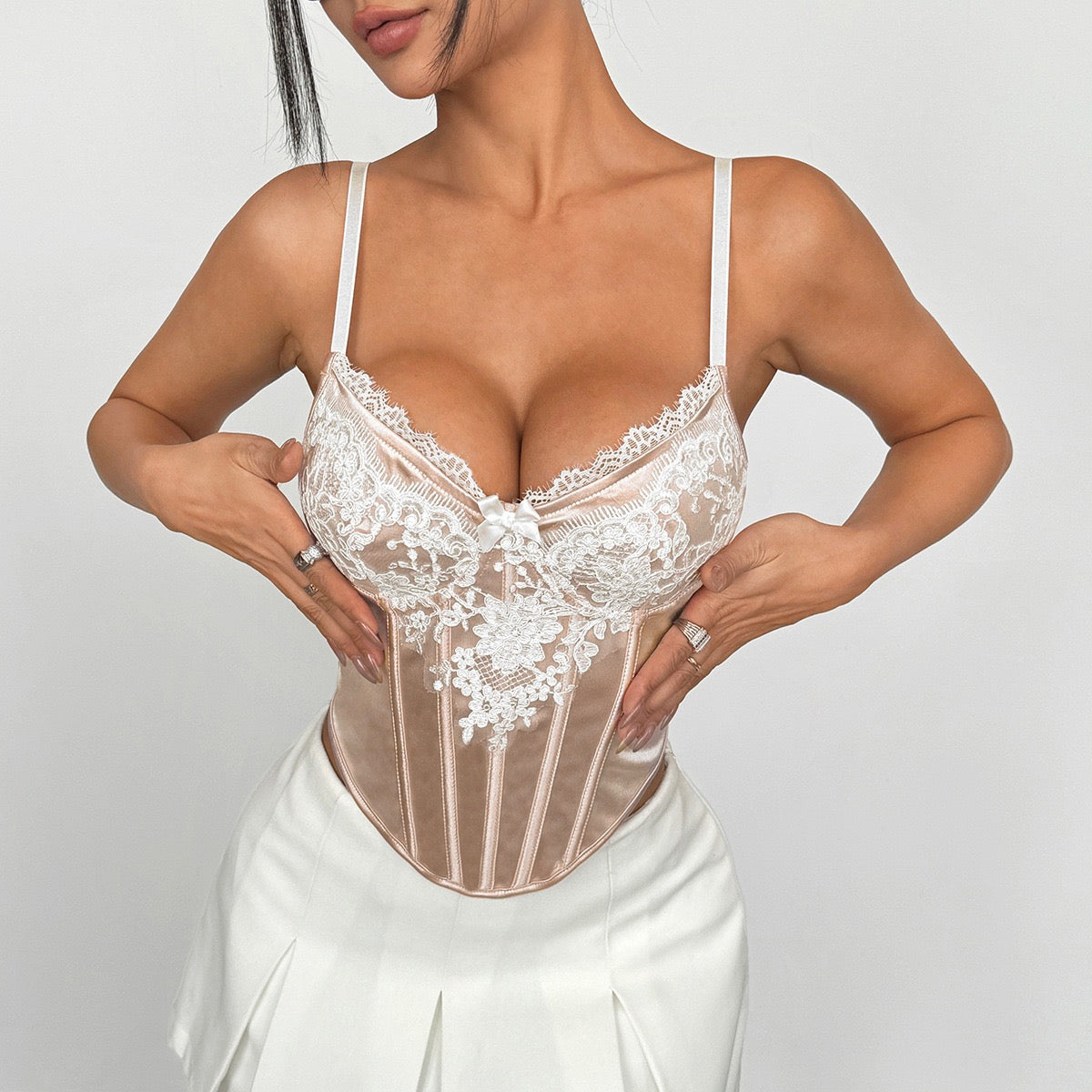 Nude pink satin corset styled with white pleated skirt – romantic aesthetic